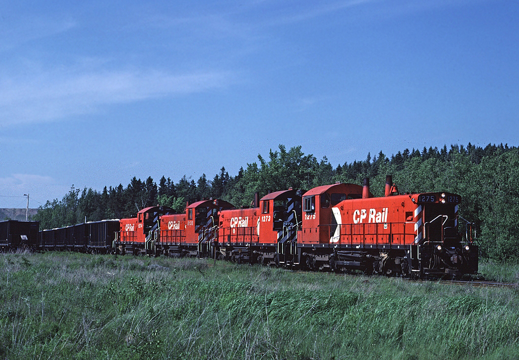 CP 1275 leads a train of loaded gypsum cars at the National Gypsum quarry at Mantua, Nova Scotia on the Dominion Atlantic.