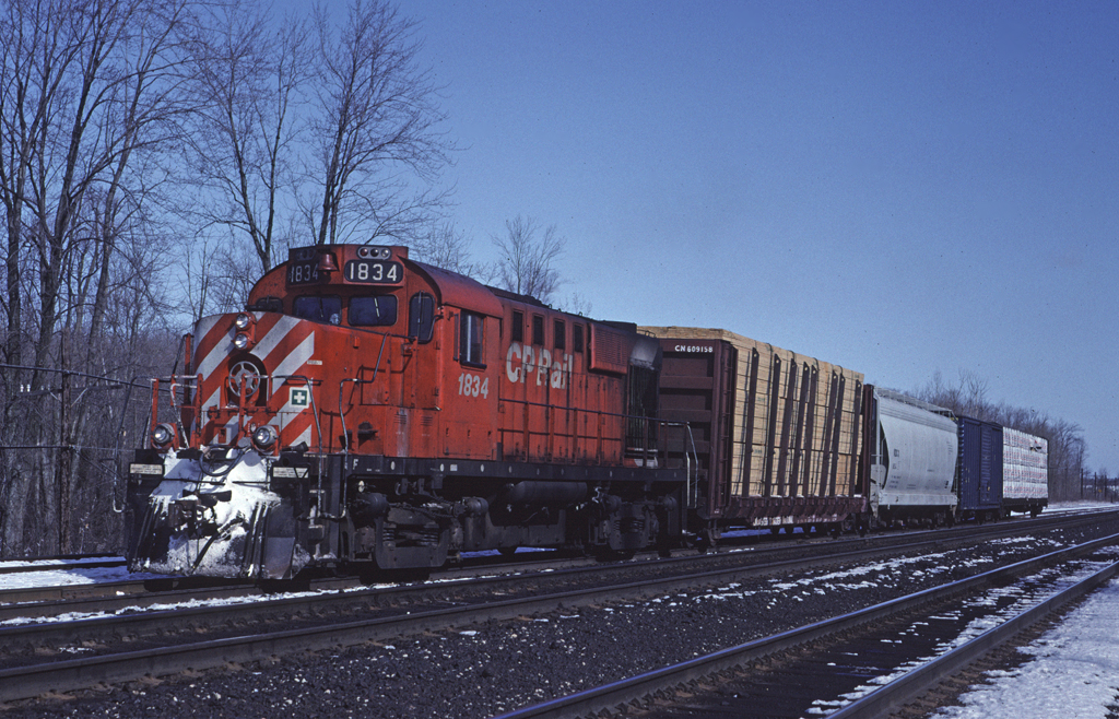 CPR RS-18u 1834 is switching at the west end of the yard at Guelph Junction.