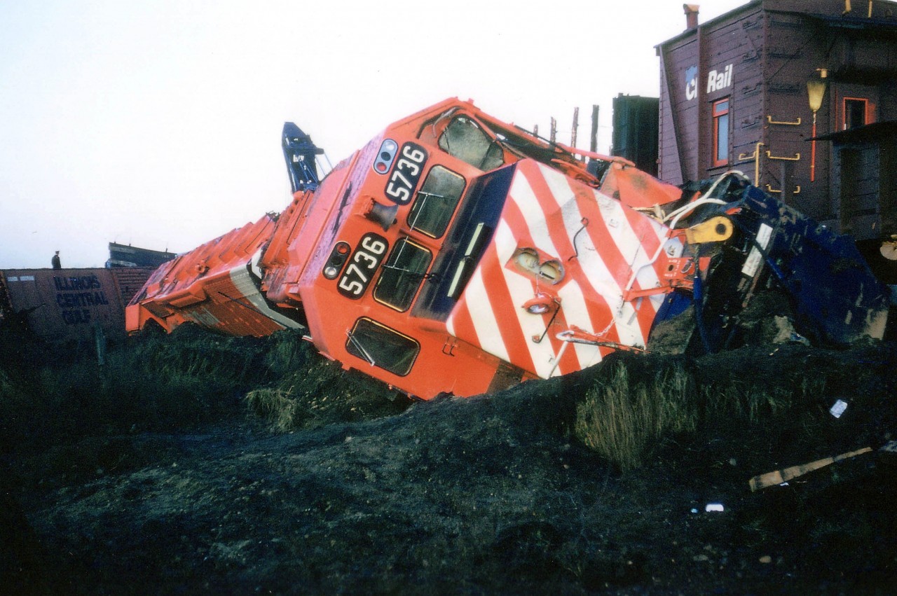 Freshly outshopped GMD London, first run east for CP 5736 and 5737, and wham!!! Hitting a gravel truck on the crossing at Concession 7 in Puslinch sent the new locomotives careening into the swamp. Truck driver killed as was head end brakeman. Accident was Nov 4, 1975; this image, the effort of which resulted in being soaked in swamp goo up to the knees, was taken the following morning.