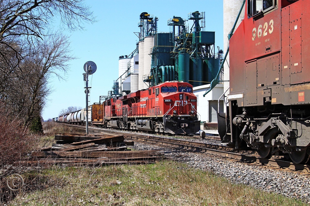Stacked in the siding behind CP 8831-254 is D&H 7304-T76 as they wait for CP 9623-243 to clear the east switch at mile 54.8 on the CP's Windsor Sub.