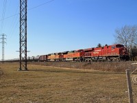CP 8841 with BNSF 9133 and BNSF 8859 power train 608-914 eastward at mile 94.6 on the CP's Windsor Sub. Some 24 hours later the same 3 units, in the same order, would be sitting in the siding at Belle River with westbound train 147.