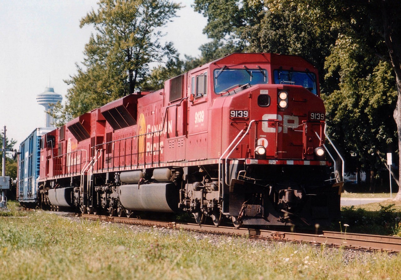 SD90MACs (Image 2) It was my understanding that these units could not operate/lead in the United States. But, somehow, train #734, shown here coming up to the Steel Arch bridge and the Land of the Free, has these units in question for power; CP 9139 and 9159(United Way decal).  I never did find out what prompted CP to use these units in Niagara.  Skylon Tower can be seen in the background.