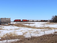 A pair of SD40-2s lead 411 past the old farm at Esmond.