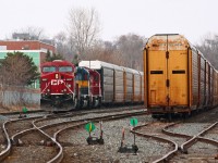Today's CP 235 had a reasonably interesting consist of CP 8887, ICE 6101, and CP 5690. With 7000' of train, they are leaving Quebec Street off the passing track with a clearance in had to Longwood where they will meet two eastbounds.