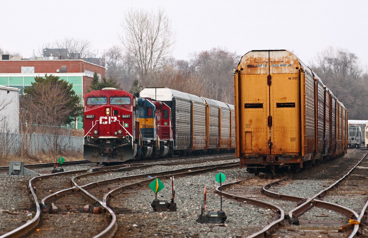 Today's CP 235 had a reasonably interesting consist of CP 8887, ICE 6101, and CP 5690. With 7000' of train, they are leaving Quebec Street off the passing track with a clearance in had to Longwood where they will meet two eastbounds.