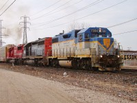 What a great latchup this was! D&H 7304 leads HLCX 6340 (ex sp) and SOO 6062 as they haul 242 out of Windsor after doing a crew change at Dougall Ave.