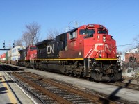 CN-8885 a SD-70-M2 leading loco of 2 locos second loco CN-2162 a C-40-8W was pulling a convoy of containers for Halifax N.S. on rte 120 near 12,000 foots long the convoy was on north side main track in St-Lambert 