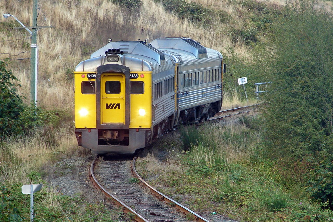 The VIA Malahat, on this day made up of two BUDD RDC cars, sadly no longer running making it's way through one of the many municipalities around Victoria before arriving at Victoria Station, also sadly no longer in existence.