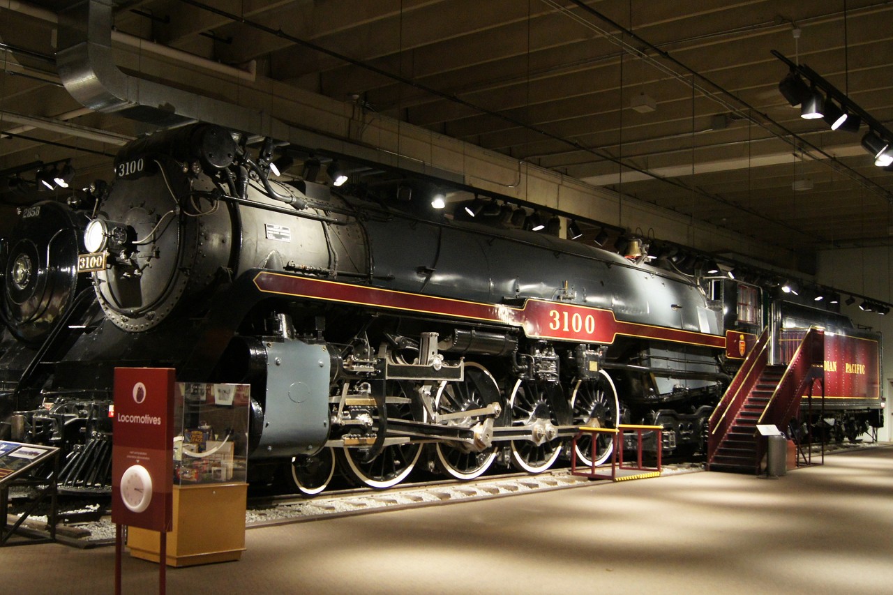 The limitations of even the best indoor display of preserved rail equipment become evident when trying to photograph said displays. Thankfully I visited on a weekday, so the museum was particularly devoid of errant children, which are all too common when trying to photograph museum displays. This 1928 Angus built "Northern" 4-8-4 is part of the Canada Science and Technology Museum's collection, of which only a small part is on public display. The red sign in the foreground indicates that a guided tour of the locomotives is available at 10:15am. The cabs are set up to allow visitors to walk through and experience what it's like to be inside a steam engine.