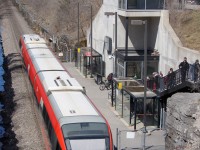 Passengers hurry to enter Carling Station to board OC Transpo (Capital Railway) C2 for a trip north to Bayview Station. The following Sunday, OC Transpo would shut down the O-Train for 16 weeks to install two passing sidings in anticipation of doubling service levels in 2014 once new trains from Alstom arrive.