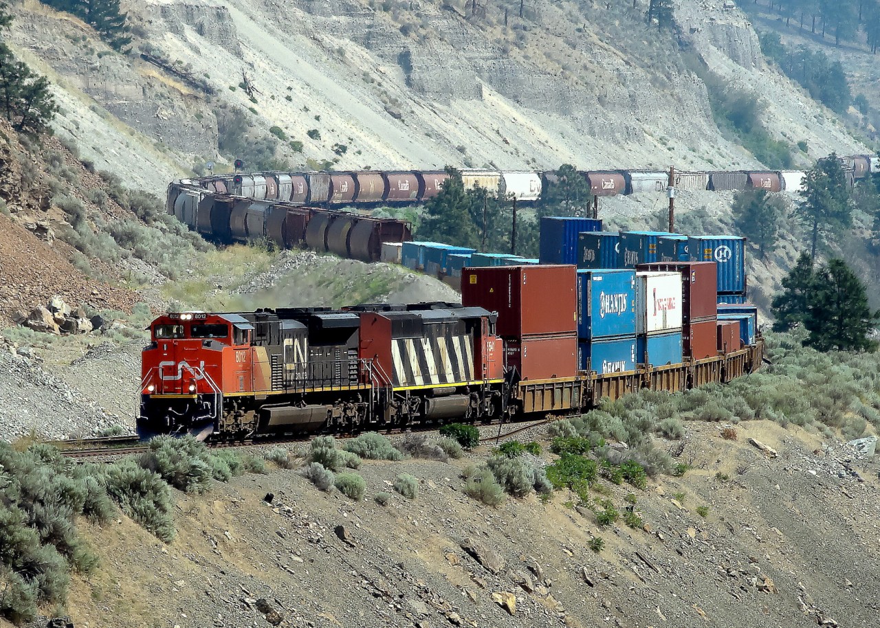 SD70M-2, CN 8012 and SD60F, CN 5541 ease their southbound train around the curves of the Thompson River Valley north of Lytton, BC.