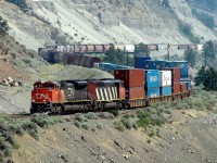 SD70M-2, CN 8012 and SD60F, CN 5541 ease their southbound train around the curves of the Thompson River Valley north of Lytton, BC.