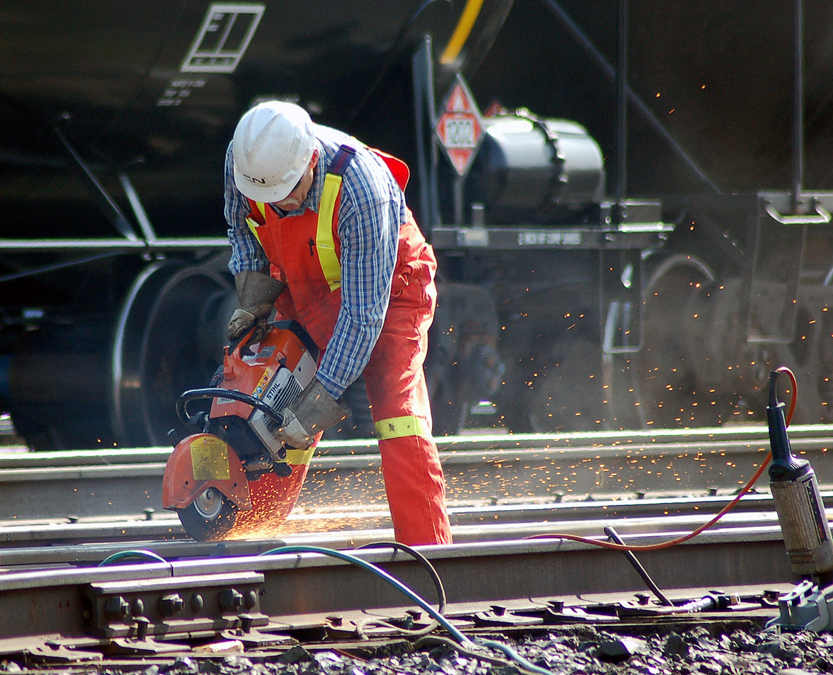 A CN Foreman performs some maintenance on a switch frog