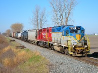 CP T76 led by D&H 7304 passes eastbound thru Jeannette mile on a beautiful sunny morning.