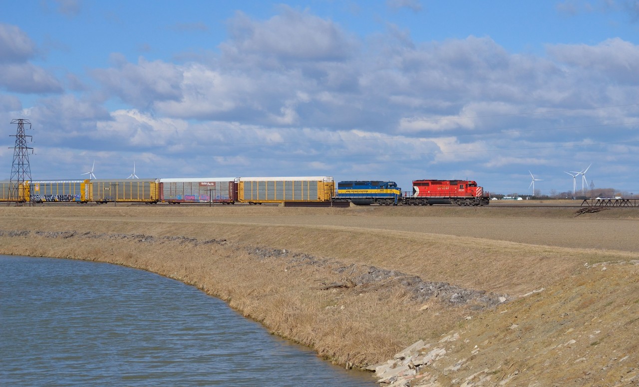 After rounding the bend out of Tilbury, CP 242 heads eastbound towards Chatham with CP 6045 & ICE 6402 doing the honours.