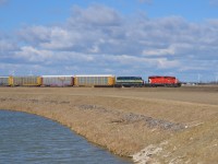 After rounding the bend out of Tilbury, CP 242 heads eastbound towards Chatham with CP 6045 & ICE 6402 doing the honours.