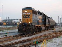 CSX 2574 works the Sarnia yard on an evening switch job. To the left can be seen the unique "yellow band" looking Sulfur tank cars at Imperial Oil. 