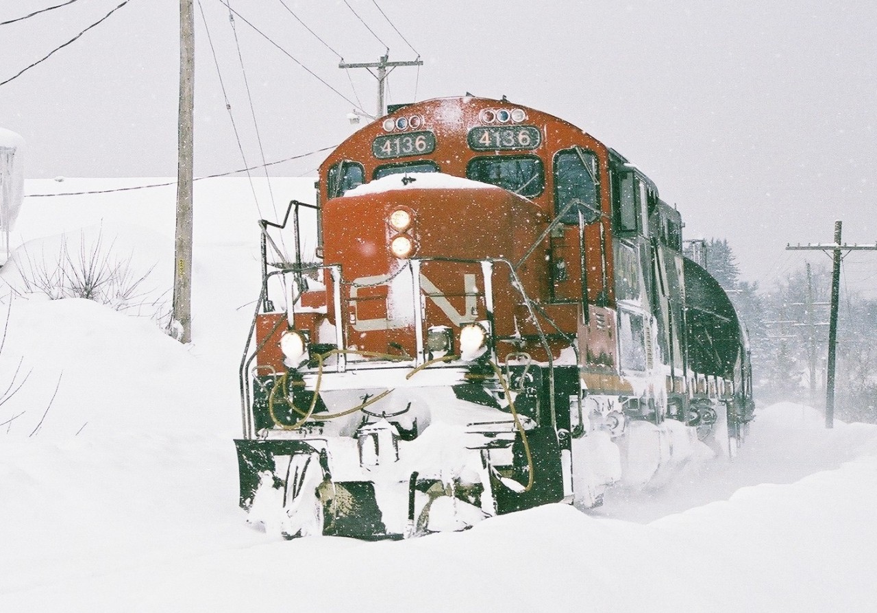 The Huntsville roadswitcher passes through Bracebridge during a squall. I was up to my knees in snow after taking one step too many on a snowbank.