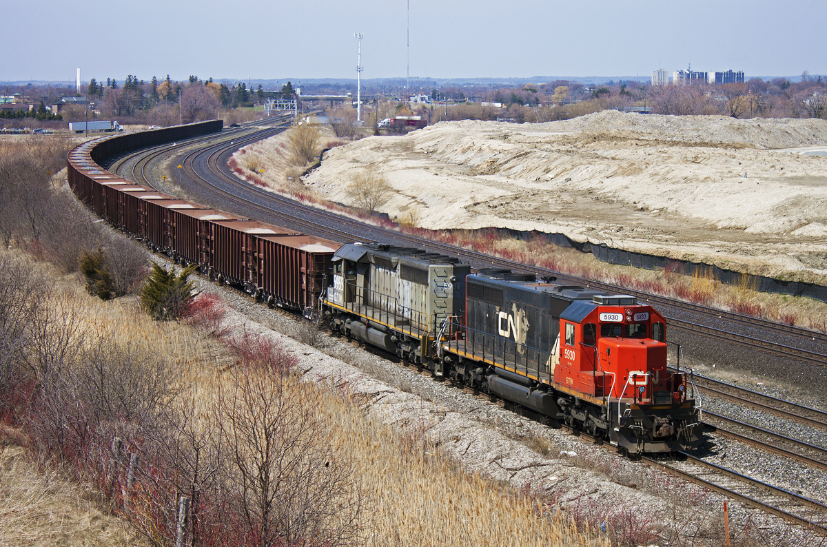 A nice surprise in the form of a W90031 23 crawls around the bend at Gerdau. The train was going into the yard to tie the train down for the afternoon and the crew would cab back to Mac Yard. From my understanding, the ballast loads are destined for Belleville for the on going track expansion to the Kingston Sub.