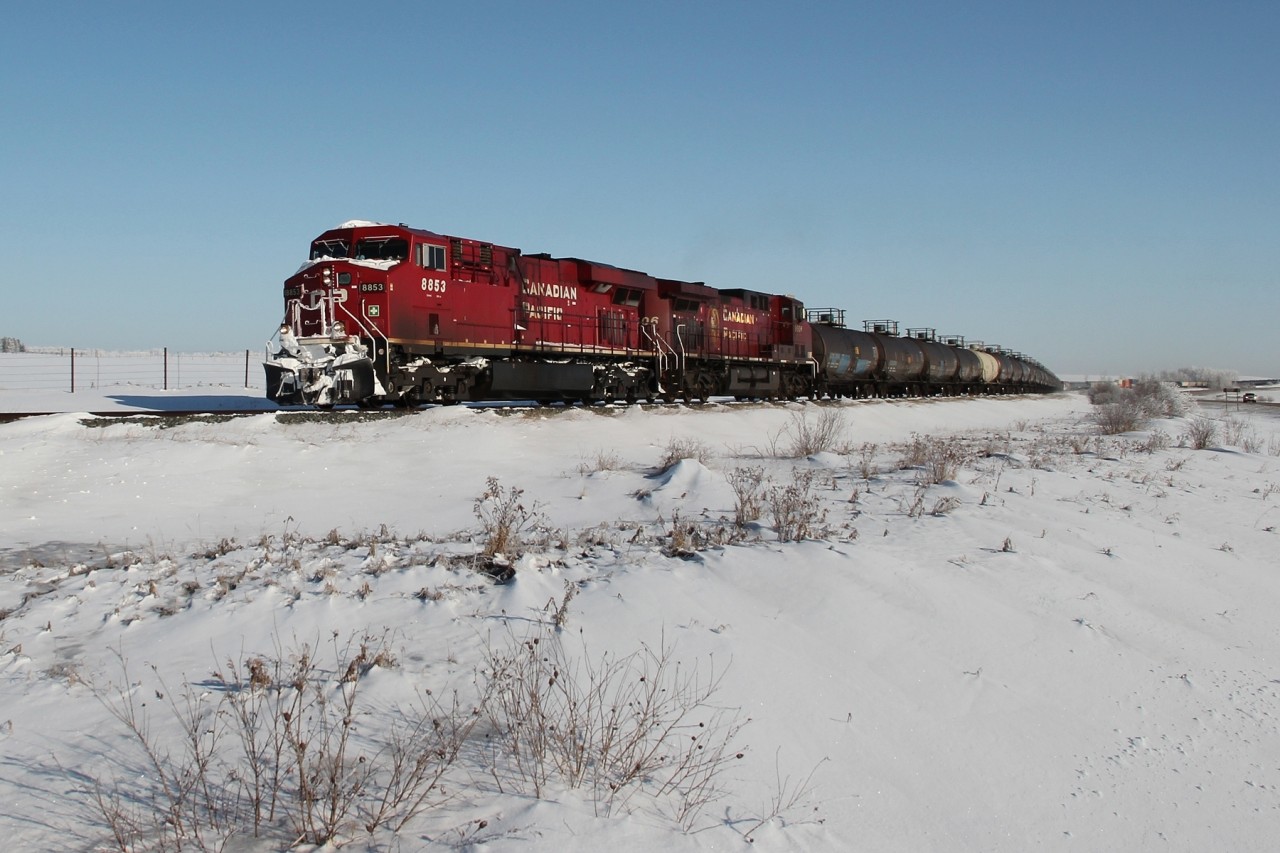 ES44AC 8853 and AC4400CW 9606 lead a Calgary bound train south on the Red Deer subdivision.