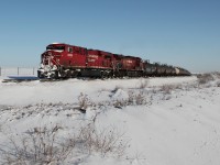 ES44AC 8853 and AC4400CW 9606 lead a Calgary bound train south on the Red Deer subdivision.