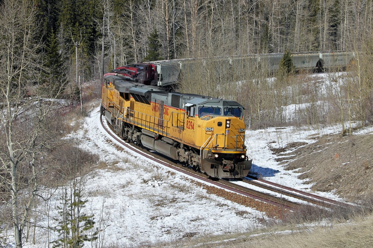 UP SD9043MAC 8294 leads Potash empties eastbound on the Crowsnet Sub.