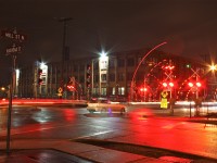 A CN westbound clears the crossing at Railroad and Mill St. creating a nice light show.