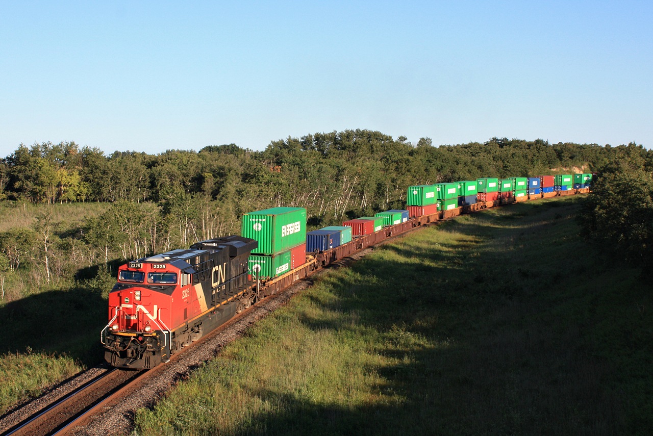 CN 106 rounds the curve east of Rivers MB early in the morning.