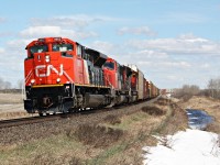 A fresh 8952 with a Mexican sticker between the numberboards takes 347 west at Code siding which is west of Gerald Saskatchewan.