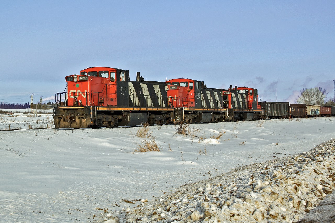A trio of GMD1's CN 1433, 1409 and 1438 bring cars off the Scotford Industrial Lead into Scotford Yard.