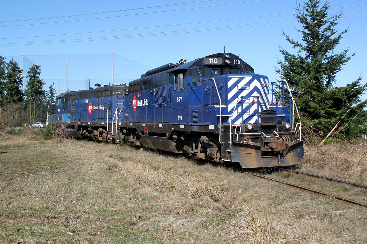 GP9 SRY 110 and GP7 SRY 129 head back to the main line having set off their tank cars at Superior Propane.