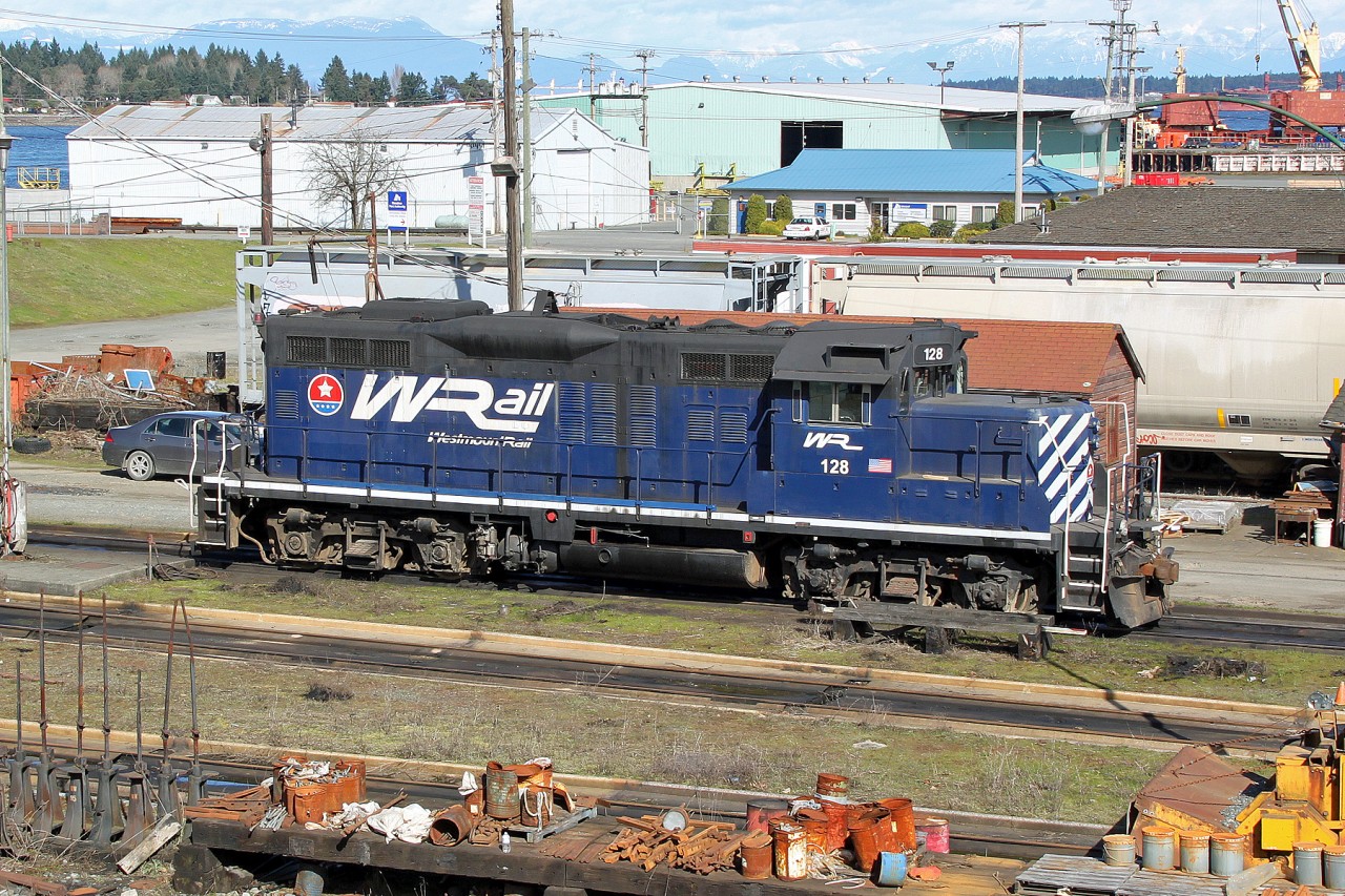GP9 SRY 128 (EX CP 1583, ex CP 8671) sits in Wellcox yard after arriving from the mainland on the morning barge.  It carries a the fictitious railroad name "Westmount Rail" and will be used shortly in a Godzilla movie sequence.