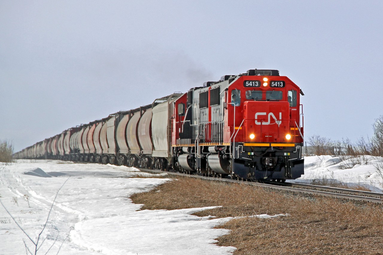 An eastbound grain train just out of Scotford is headed by CN 5413 one of the new (to CN) SD60s aquirred from Oakway leasing.