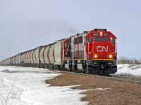 An eastbound grain train just out of Scotford is headed by CN 5413 one of the new (to CN) SD60s aquirred from Oakway leasing.