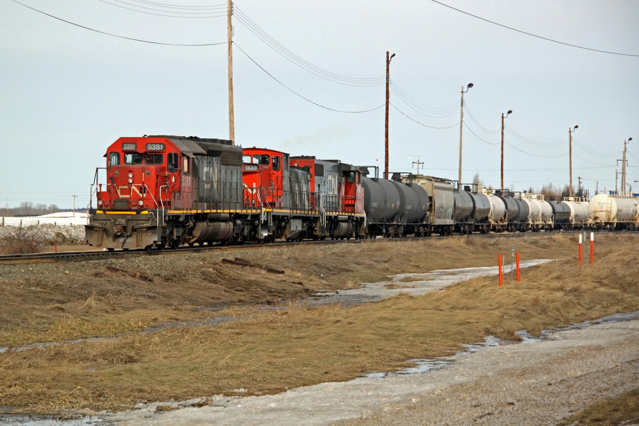 SD40-2 CN 5381, GMD1 CN 1423 and SD38-2(W) are seen switching tank cars at Scotford Yard.