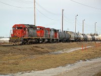 SD40-2 CN 5381, GMD1 CN 1423 and SD38-2(W) are seen switching tank cars at Scotford Yard.