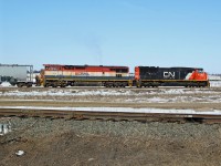 Not seen often these days a BC rail loco in the old red, white and blue stripes. SD 75i CN 5778 and Dash 8-40CMu BCOL 4621 use the Scotford Industrial Lead to pull through the yard before splitting their train for parking.