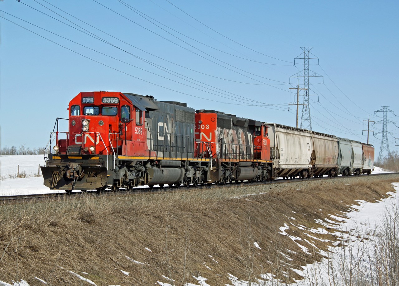 SD40-2 CN 5369 and CN 5303 bring 5 cars from Scotford yard heading for the Sturgen industrial lead just another 1/2 mile down the track.