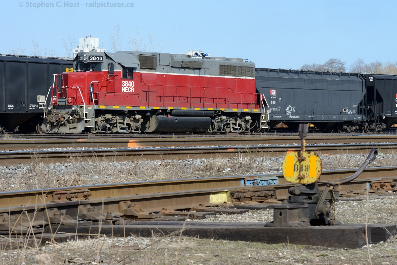 B43: NECR 3840 basks in the afternoon sunlight framed beside an old CN Switch (Dating to '65 or so) in the SOR Yard at Hamilton.