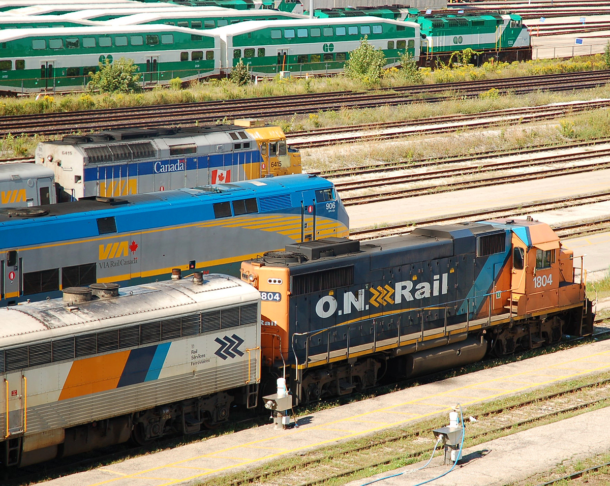 Many different kinds of passenger power (GP38-2, P42, F40PH, F59PH) mingle in the yard at Mimico on a saturday afternoon
