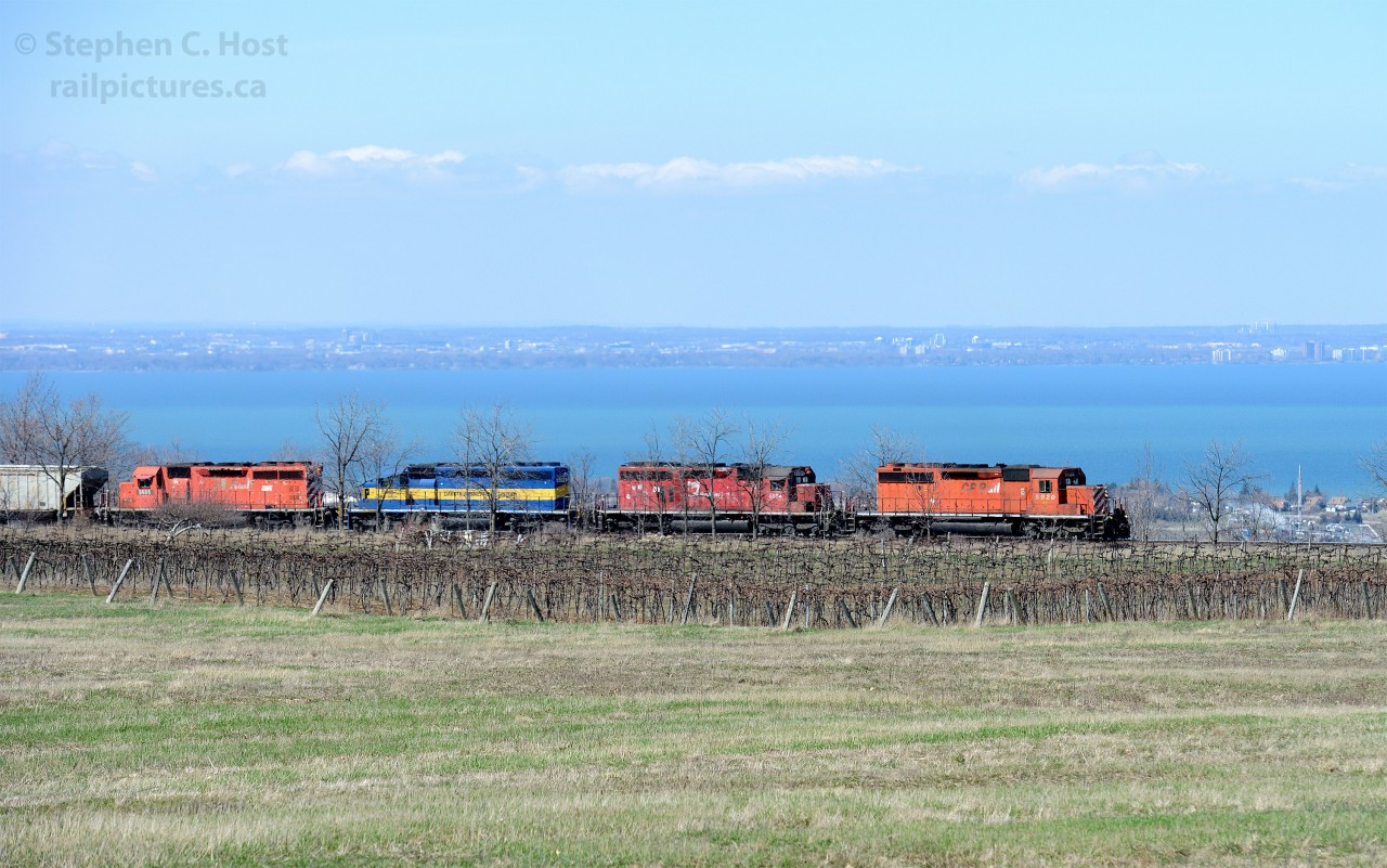 650 feet is the height of the Niagara Escarpment at Vinemount, Ontario and four 645's are groaning in protest as train 640 has nearly finished the climb.  At 650 feet high one can see many things in the background - Lake Ontario for one -  in front of the Lake is Stoney Creek, and in the background Burlington and Oakville, Ontario. 

The suggested photos below will show many TH&B and CP photographs from other great photographers over the years.