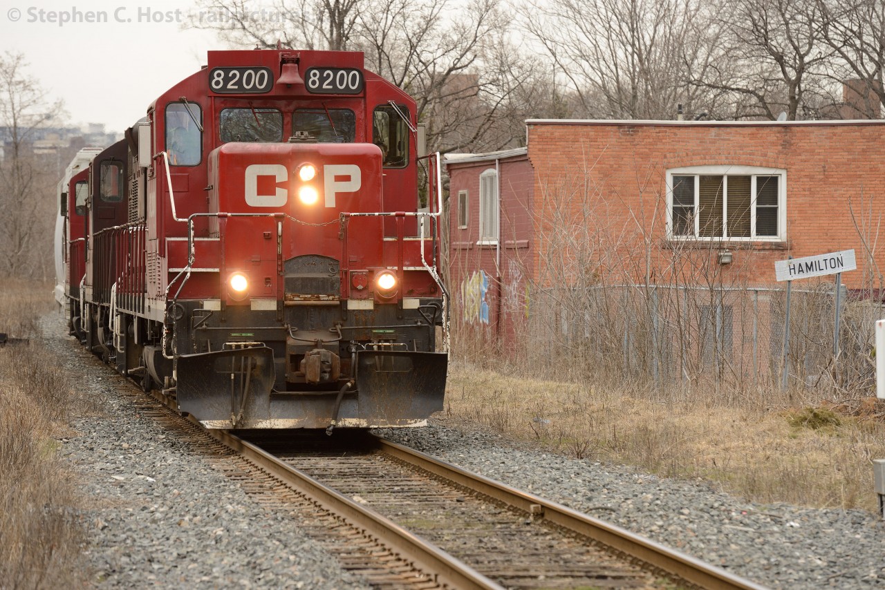 Hamilton A small and insignificant marker, as compared to other landmarks, but important nonetheless - the Nortbbound mileboard for Hamilton Station is shown as CP Kinnear Yard job TG31 returns from Aberdeen Yard with a single car.