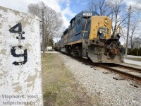 <b>Last Days: </b> The end is near for the CSX south of Sarnia as Cando plans to take over operations from at least Wallaceburg to Chatham, Ontario. Concrete painted milesigns and whistleposts dot this railway as a testament to solid construction and investment of the Erie and Huron Railway in the late 1800's. This is train D724 who had work at Wallaceburg, Tupperville, and Sombra on this day.