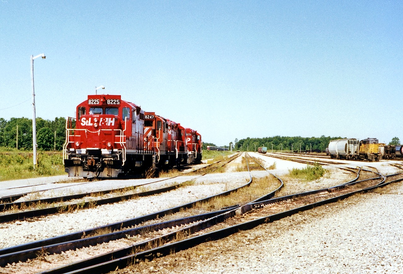 From a collection I purchased, we get a nice mid-summer morning view of the CP yard at Welland and a four-pack of geeps awaiting assignment. Off to the right is CP 5430, still in UP paint during CP's "anything that runs" days of the 1990's. There was no date given for the photo, but we can approximate it to 1997 since STLH 8225 is in fresh paint. Note: taken from railway property, do not attempt this shot!