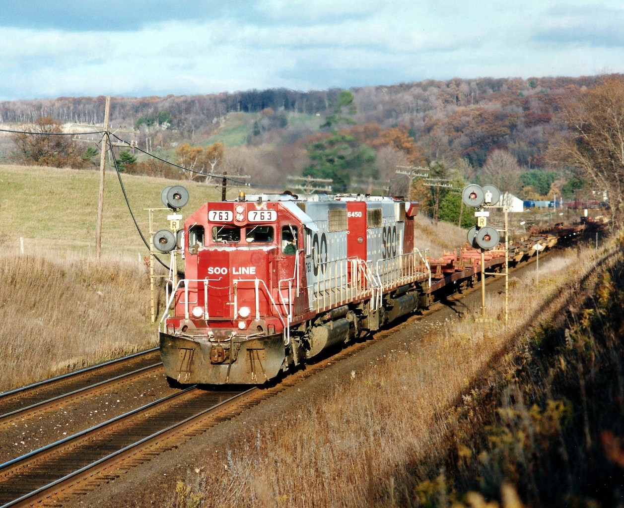 The SOO had one cabless "B" unit on their roster thru the 1990s. Here it looks somewhat of an oddity as it rolls west on train #503, as seen from the horse farm just east of Canyon Rd. It is getting late in the afternoon as SOO 763 and 6450 climb the long grade to Campbellville. The "B" was retired in 2002.