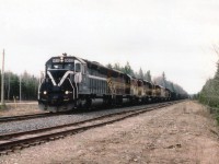 [editors note: accepted for rarity - railway no longer exists and lead unit rare] Another one of those gloomy days, but if the sun had been out, it would have been right in my face. Quite the lashup on WC #11, WC 6632, 6614, FRV 1702, WC 6588, 6604, 6655, 3012 and 6506 northbound about 15 miles out of Hawk Jct. on the  former ACR line, which was taken over by WC in 1995 which in turn was taken over by CN in 2001. I believe the lead unit is in MKCX paint; the third unit is Fox River Valley.