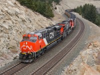 CN ES44ACs 2809 and 2801 grind their way into Jasper with a loaded coal train.