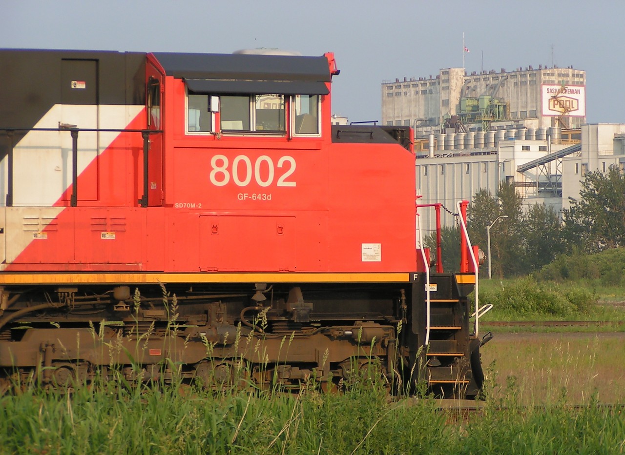 Almost new SD70M-2 CN 8002 poses on track TC 92 at the Thunder Bay North yard. In the background Saskatchewan Pool Elevators 7A and 7B fill the skyline in the Intercity area at Thunder Bay.