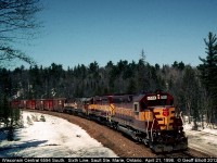 WC SD45 6594 leads a southbound freight around the curve at Sixth Line, just north of Sault Ste. Marie, Ontario.  In the consist are another SD45, Algoma Central GP38-2, and a WC SDL39!  
