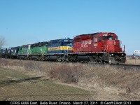 CPRS SD40-2 #6066 commands an eastbound ethanol train with a colorful mix-mash of paint schemes for power leading the way.